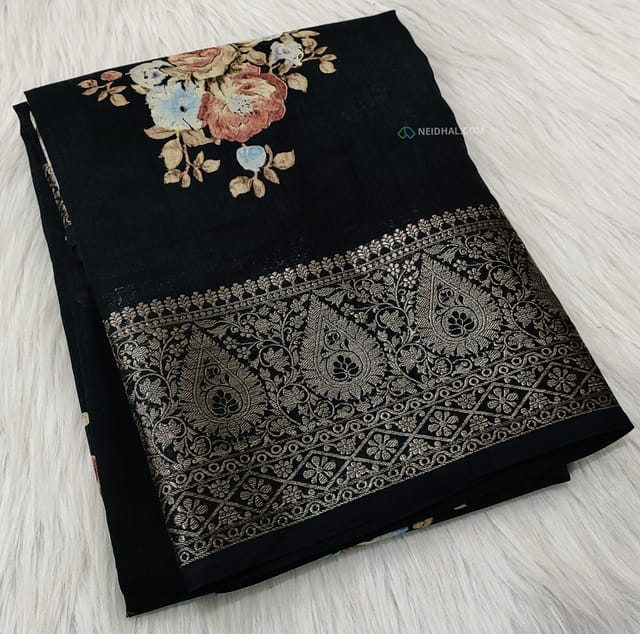 CODE WS670 : Black fancy dola silk saree(silky and lightweight) zari woven double side borders, beautiful floral prints all-over, striped pattern and floral printed pallu, plain running blouse with borders.