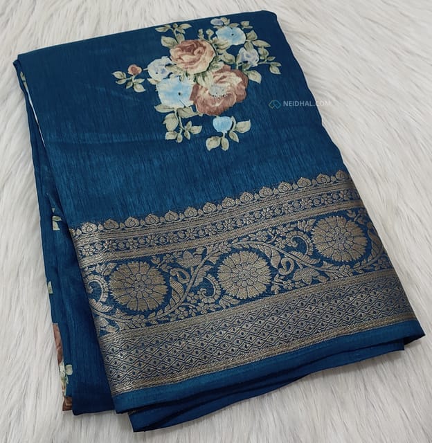 CODE WS668 : Dark turquoise blue fancy dola silk saree(silky and lightweight) zari woven double side borders, beautiful floral prints all-over, striped pattern and floral printed pallu, plain running blouse with borders.