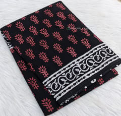 CODE WS680 : Black soft mul cotton saree with traditional red block prints all over, hand block printed pallu and plain black running blouse.