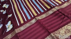 CODE WS694 :Maroon fancy dola silk saree with floral prints all over, big gap borders on one side (lightweight and casual sarees) printed striped pallu,plain running blouse with borders.