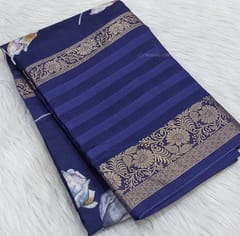 CODE WS695 :Navy blue fancy dola silk saree with floral prints all over, big gap borders on one side (lightweight and casual sarees) printed striped pallu,plain running blouse with borders.