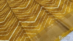 CODE WS753 : Dark fenugreek yellow fancy dola silk saree with shibori prints all over ,simple gold tissue borders , printed pallu and running printed blouse with borders.