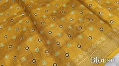 CODE WS753 : Dark fenugreek yellow fancy dola silk saree with shibori prints all over ,simple gold tissue borders , printed pallu and running printed blouse with borders.