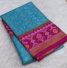 CODE WS775 : Turquoise blue premium silk cotton saree with rich thread and zari woven ikat patterns all over, contrast borders, rich ikat woven pallu with tassels, contrast plain running blouse .