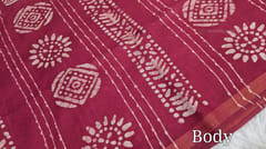 CODE WS782 : Dark pink original wax batik dyed silk cotton saree ,with knot work all over, contrast pallu with wax dyed batik designs and knot work ,running plain blouse with gold zari borders.