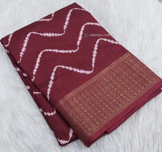 CODE WS789 : Maroon fancy dola silk saree with zig zag prints ,soft zari woven double side borders,ajrak printed pallu,bandhani printed blouse with borders.