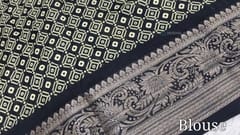 CODE WS816 : Black fancy dola silk saree(silky and light weight ),fancy zari woven double side borders, abstract floral prints all over, printed pallu , running printed blouse with borders.