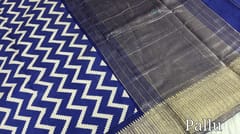 CODE WS819 : Ink blue pure assam silk saree with ikat prints all over(soft and flowy fabric), soft antique zari woven double side borders, zari woven pallu, running blouse with borders.