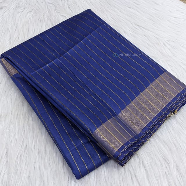 CODE WS841 :  Navy blue semi tussar saree (soft and lightweight ) vertical gold zari lines all over saree, tissue borders on both sides , sequence and thread work pallu with tassels, plain running blouse with gold tissue borders.