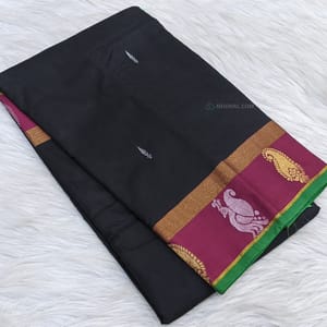 CODE WS922 : Black soft silk cotton saree (light weight)with small zari buttas(gold and silver) all over saree, double side borders with beautiful zari work , contrast pallu ,running blouse with borders.