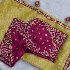 CODE WS995 : Golden yellow with golden tint tissue silk cotton saree(thin and lightweight) with bright pink designer tapings as borders, tapings for pallu with fancy tassels,designer readymade dark bright pink blouse with zardozi and sequence work (height 15 inches, armhole-to-armhole 19 inches, elbow length sleeves ( length:9.5 inches) fits upto size L,40,can be altered to smaller sizes) also comes with dark pink plain running blouse. DRY CLEAN RECOMMENDED