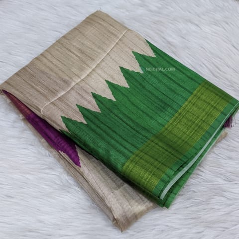 CODE WS1028: Beige semi tussar saree with dual shade temple borders(green, purple) with gold tissue,textured pattern all over, striped pallu with tassels,plain running contrast blouse with borders.