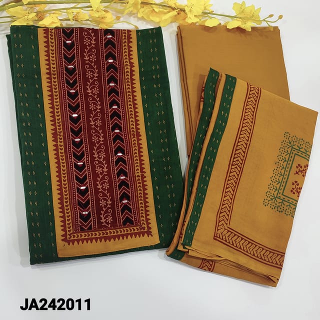 CODE JA242011 :Bottle green premium dobby cotton unstitched salwar material,thread woven buttas all over,contrast ajrak printed yoke patch with foil detailing(lining optional)contrast fenugreek yellow cotton bottom,block printed premium mul cotton dupatta with tapings.