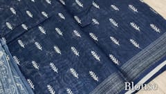 CODE WS1185 : Indigo blue fancy linen saree with beautiful digital prints all over,silver tissue borders,printed pallu with tassels,printed running blouse with soft silver tissue borders.