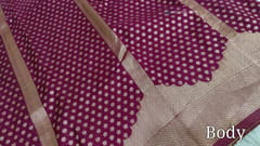CODE WS1195 : Beetroot purple banarasi viscous georgette saree with antique gold zari woven buttas all over,zari woven pallu and rich zari woven pallu(lightweight)contrast dark green blouse with zari woven buttas with borders.